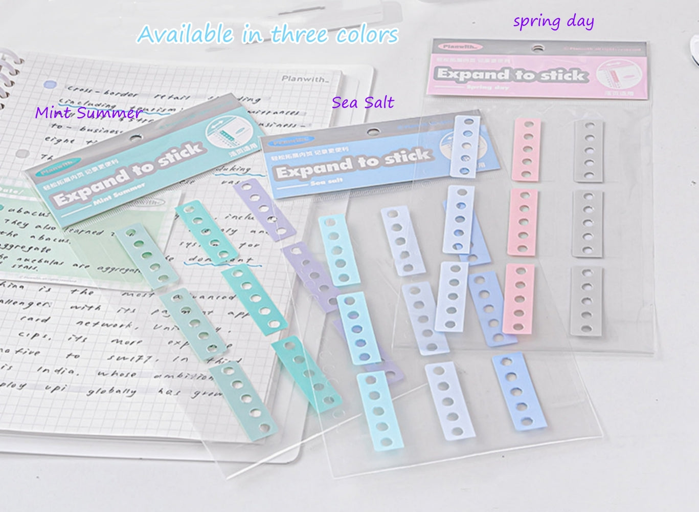 Binder extension stickers hole reinforcement tabs in three color on the table Green Blue Pink and Grey color