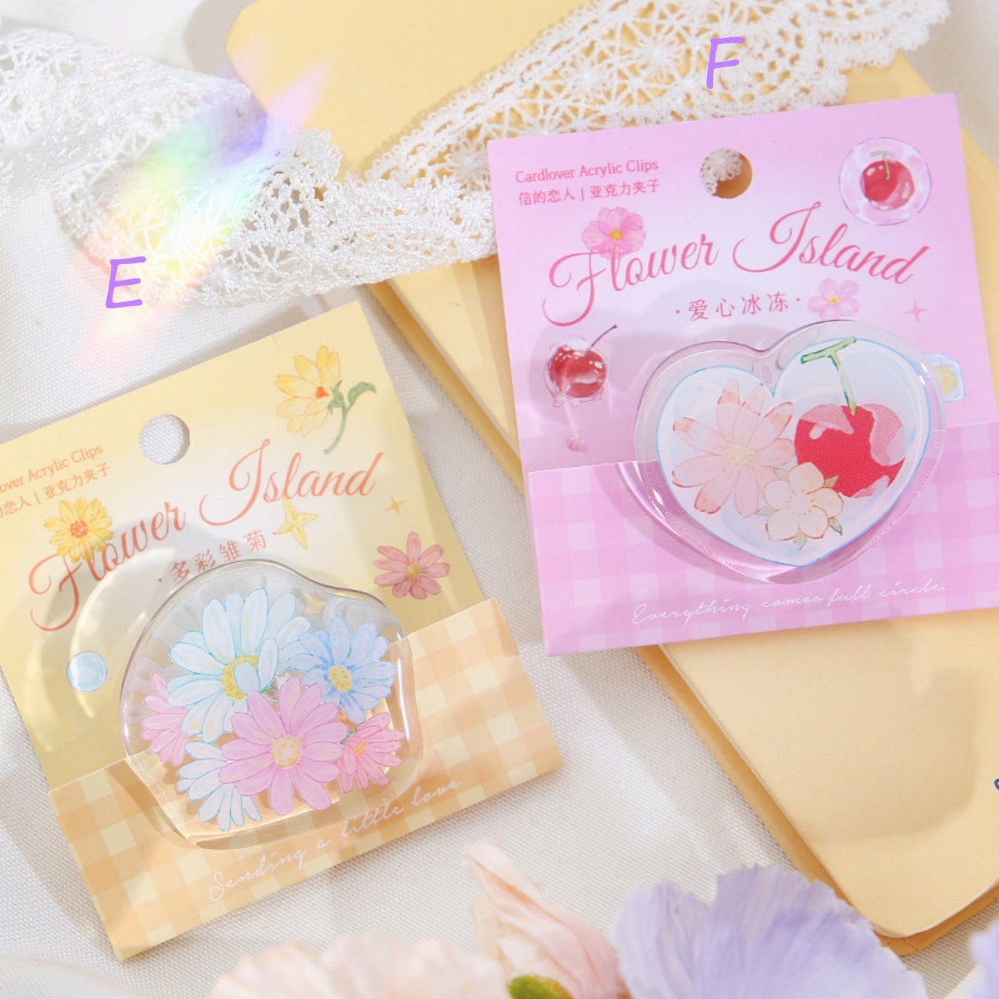 Two Floral Paper Clips with Yellow and Pink Packages