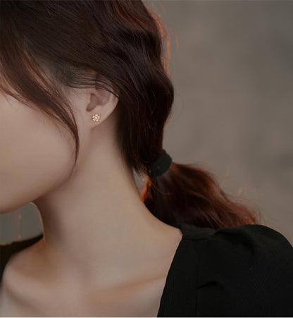 Woman Wearing Pink Sakura Flower Earrings