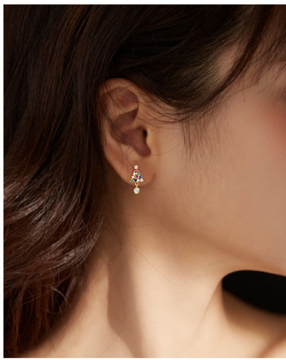 A Woman Wearing a Christmas Tree Earrings with Colorful Cubic Zirconia 